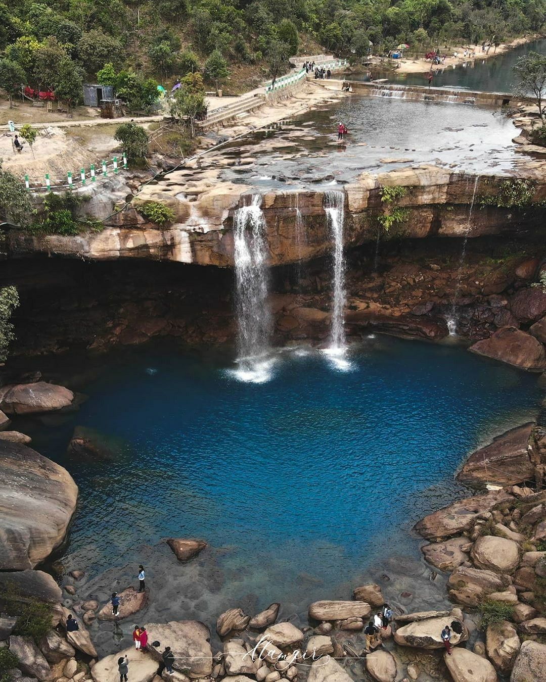 A stunning view of the turquoise waters of Krang Suri Falls