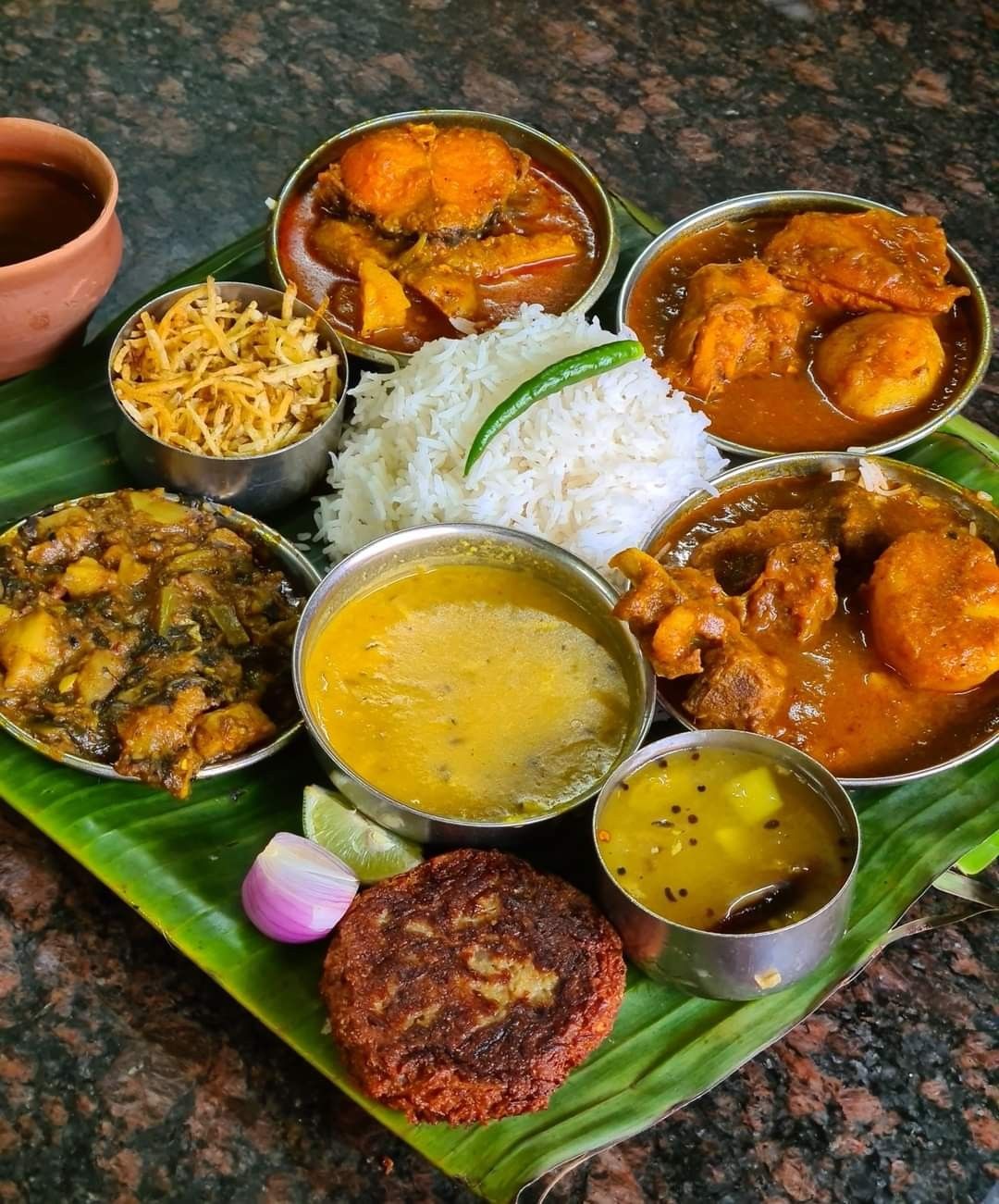 A close-up of local Khasi food, including Jadoh, on a plate