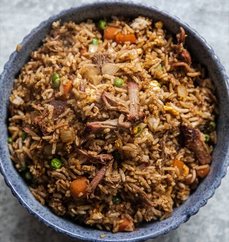 A plate of traditional Meghalayan cuisine, like Jadoh or smoked meat.