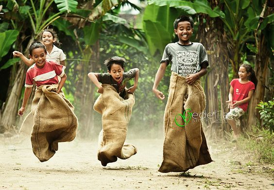 Children playing in a clean village, possibly Mawlynnong.