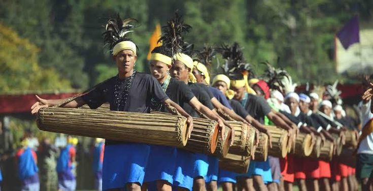 A festival procession with vibrant costumes and people