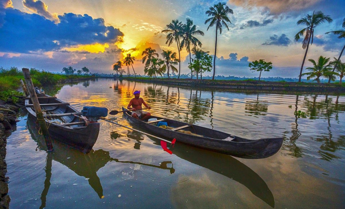 A boat floating on the crystal-clear waters of the Umngot River at Shnongpdeng