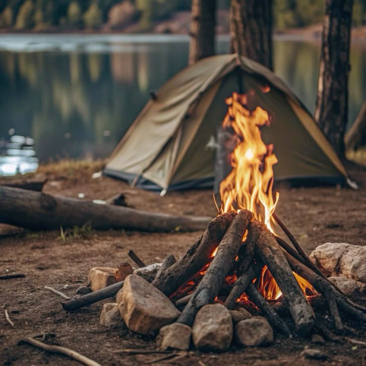 A row of tents set up for camping along the bank of the Umngot River
