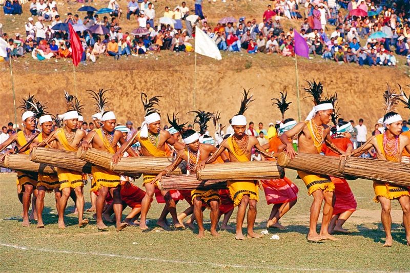 A group of local villagers in traditional attire during a festival.